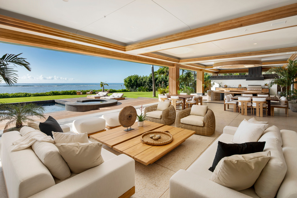 Open-air luxury living room overlooking the ocean in Hawaiʻi.