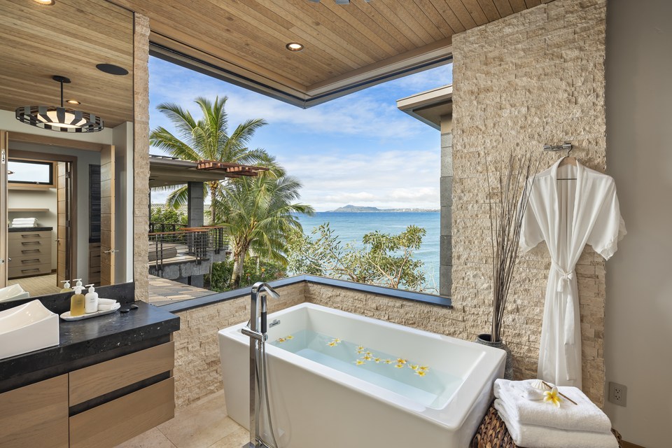 Open-air bath with a view toward the ocean.