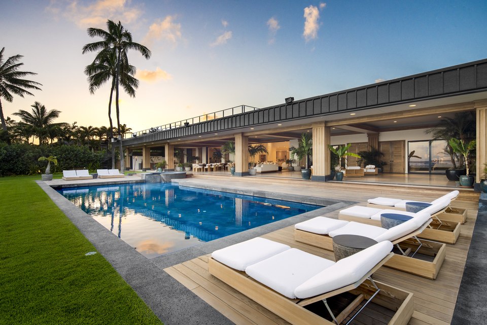 Pool terrace and lawn facing the ocean.