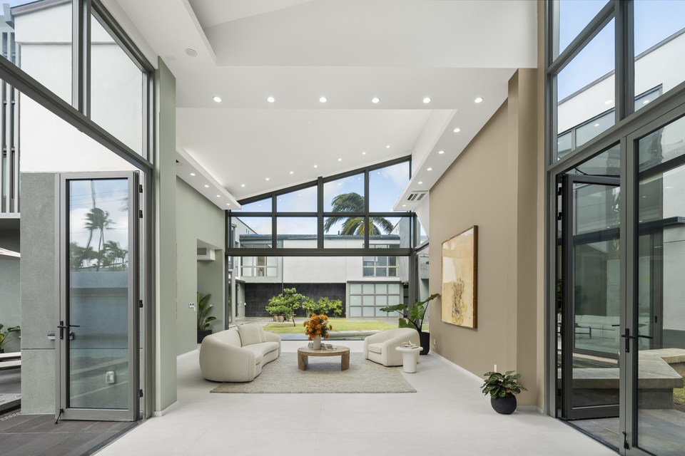 Double-height living room opening to an interior courtyard.