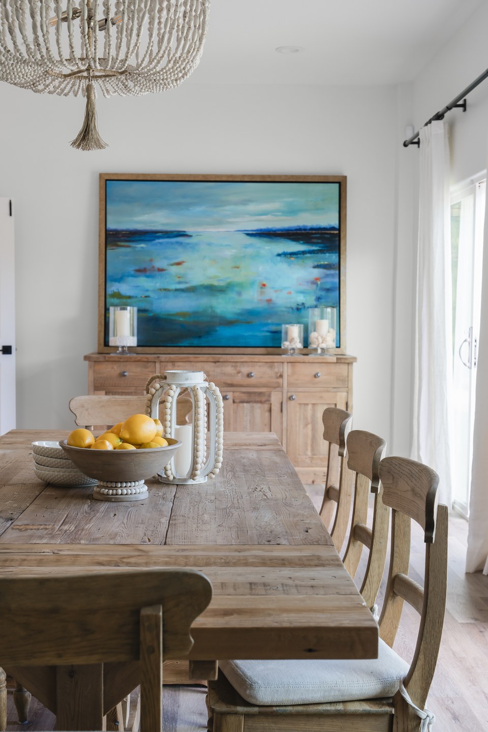 Interior dining detail with woven forms and soft neutral materials.