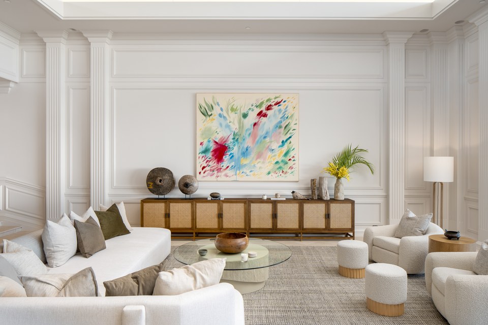 Refined Kahala living room with sculptural furnishings and original artwork.